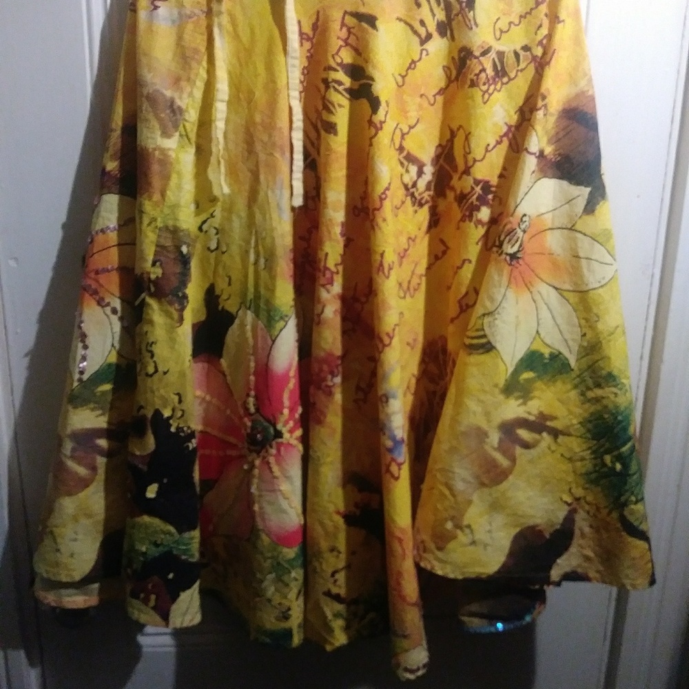 Handmade yellow skirt with sequins looks like a sm